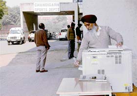 A person operates xerox machine at the entrance to the office of SDM (South) in the Sector 42 sports complex, Chandigarh