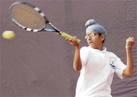 Tennis player Bhavtaran Singh returns a shot during St Peter’s tennis tourney at St Peter’s School in Chandigarh