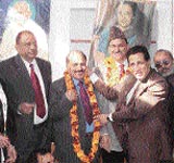 Party leaders facilitating newly inducted ministers into the Jammu and Kashmir cabinet in Jammu on Wednesday.