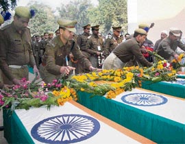 Policemen lay wreaths on coffins of CRPF jawan killed during Tuesdays terrorist attack at their camp in Rampur on Wednesday.