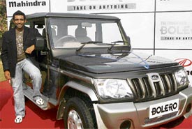 Cricketer Robin Uthappa poses with a Mahindra Bolero Special Edition at its launch in New Delhi on Thursday.