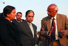Justice A K Sikri (M) and Justice Rekha Sharma (L) visit the site of Commonwealth Games village near the Akshardham Temple in the Capital on Thursday.
