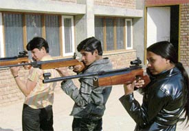 Saroj Chauhan takes aim with her rifle at the Government College for Girls, Fatehabad.