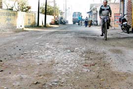 The top layer of a road in Sukhdev Nagar, Ludhiana, has worn off.