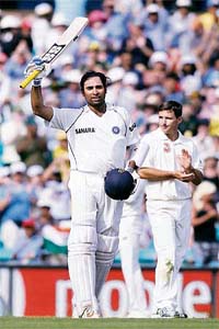 VVS Laxman raises his bat to acknowledge the crowd after his century during day two of the second Test against Australia at the Sydney Cricket Ground