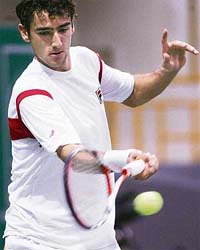 Croatian Marin Cilic hits a return to his French opponent Nicolas Mahut during their second round match at the ATP Chennai Open in Chennai