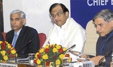 Union finance minister P Chidambaram with financial services secretary Vinod Rai (L) and minister of state for finance Pawan Bansal at a meeting with chief executives of public sector banks in New Delhi on Friday. 