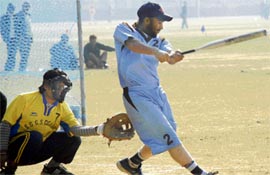 A player in action during an inter-college softball match at Panjab University on Friday.