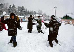 Tourists seem to enjoy during snowfall, pelting each other with snowballs, at Gulmarg, 51 km from Srinagar