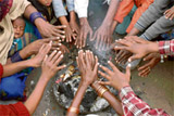 Poor people light a fire to keep the cold at bay in Ludhiana