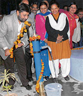 Mayor Pardeep Chhabra inaugurates a hand pump in Chandigarh on Sunday.