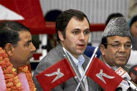 National Conference president Omar Abdullah (centre) along with Ramesh Mottan (left) and former finance minister A.R. Rather, addresses mediapersons in Jammu