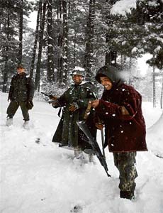 CRPF officers enjoy during heavy snowfall in Tangmarg, 43 km from Srinagar
