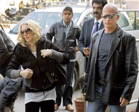 Pop star Madonna (left) arrives at the airport in Jodhpur on Sunday. The pop star is on a vacation with her family in Rajasthan