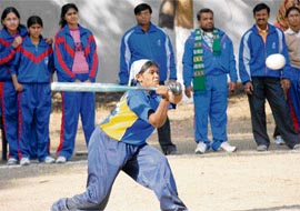 A girl plays softball during National School Games in Chandigarh on Monday.