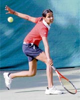 A player in action during the ITF Tennis Tournament in Chandigarh on Monday.