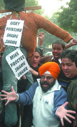 Activists protest against the three-test ban on cricketer Harbhajan Singh in the Capital on Monday.