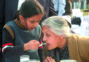 Chief Minister Sheila Dikshit tastes a dish during a lunch hosted by her for the media at her residence in the Capital on Monday.
