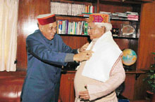 Chief Minister Prem Kumar Dhumal meets Railway Minister Lalu Prasad Yadav in New Delhi on Monday.