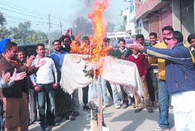 City residents burn an effigy of ICC to protest three-match ban on Indian off spinner Harbhajan Singh, in Jalandhar on Monday. 