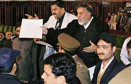 Panthers Party chairman and MLC Prof Bhim Singh and party chief in the Assembly Harsh Dev Singh protesting during the budget session.