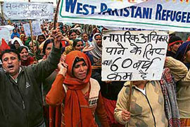 Refugees from West Pakistan who migrated to the Indian side during Partition protesting in Jammu on Monday.