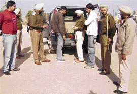 Paramjit Singh Gorayan, DSP, Dakha, supervises a naka at Jagera Bridge near Ahmedgarh on Monday.