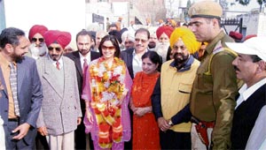 Office-bearers of a few organisations flank Dr Ruby Dhalla, Canadian MP, after her felicitation at Pohir village near Ahmedgarh on Monday.