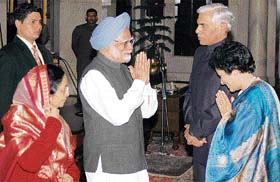 President Pratibha Patil and Prime Minister Manmohan Singh with new comptroller and auditor general Vinod Rai and his wife during his oath-taking ceremony at Rashtrapati Bhavan in New Delhi