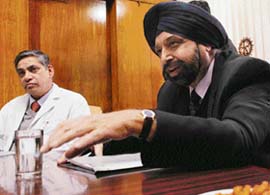 Prof J.S. Bajaj, NAMS emeritus professor, makes a point at the PGI on Monday. Prof K.K. Talwar, PGI director, is also seen in the picture.