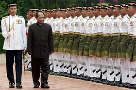 Defence minister A.K. Antony inspects the Royal Malay Regiment guard of honour during his welcoming ceremony at the Ministry of Defence in Kuala Lumpur