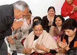 Chief Minister Bhupinder Singh Hooda greets AICC general secretary and Haryana in charge Margret Alva after presenting her a shawl at the Haryana Pradesh Congress Committee office in Chandigarh