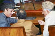 J and K Chief Minister Ghulam Nabi Azad interacts with deputy chief minister Muzaffar Hussain Baig and Qazi Mohammed Afzal during the ongoing budget session in Jammu on Tuesday.