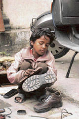 Rajesh (8), a student of Class III at Goverment Primary School, Mandi, has left studies to work to supplement the earnings of his poor parents.