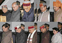 Governor V.S. Kokje administers the oath of office and secrecy to (from top left) Gulab Singh, I.D. Dhiman, J.P. Nadda, Ravinder Ravi, Kishan Kapoor, Narender Bragta, Ramesh Dhawala, Rajeev Bindal and Shraveen Chaudhary at Raj Bhawan in Shimla on Wednesday.