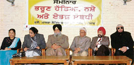 Dignitaries listen to a speaker at a seminar on female foeticide, organised by Malwa Sabhyacharak Manch in connection with the Lohri Mela in Ludhiana on Wednesday.