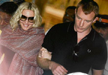 US multiple Grammy award winning pop star Madonna and her director husband Guy Ritchie leave the historic Presbyterian Church of St John the Evangelist, better known as Afghan Church - built by the British to commemorate the dead of the First Afghan War of 1838 - in Mumbai on Wednesday.