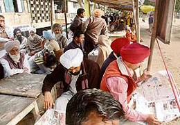 Notary public and typists while away time due to the heavy police bandobast in the courts complex during the hearing of City Centre Scam case in Ludhiana on Thursday. 
