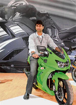 Rajiv Bajaj, managing director of Bajaj Auto, poses with sports bike Ninja 250 R, in New Delhi
