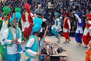 Students of DAV Public School celebrate Lohri on the school campus in Patiala on Friday. 