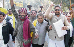 Activists of the Haryana Janhit Congress (BL) led by secretary of the HPCC Satpal Kaushik (right) hold a procession in Yamunanagar 