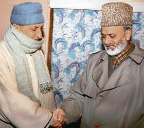 Jammu and Kashmir Peoples League chairman Sheikh Abdul Aziz (right) shakes hand with former Hurriyat Conference chairman of the Mirwaiz group, Prof Abdul Gani Bhat in Srinagar