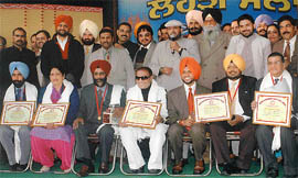 Functionaries of Malwa Sabhyacharak Manch with the recipients of gold medals during Lohri Mela celebrations in Ludhiana on Thursday.