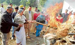 GIVING RULES A BYPASS: Health minister Laxmi Kanta Chawla burns medical waste at Nangal on Friday.
