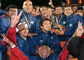 Bangalore Hi-Fliers players rejoice after winning the Premier Hockey League title at the Sector 42 Hockey Stadium