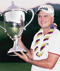 Daniel Chopra holds the trophy after winning the Mercedes-Benz golf tournament in Kapalua, Hawaii, recently.