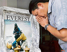 amling Sherpa pays obeisance to a portrait of his father Tenzing Norgay Sherpa and Sir Edmund Hillary at his office Kathmandu