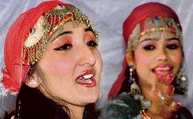 Girls sing folk songs at the inaugural function of Anant Singh College of Education in Jammu on Saturday.