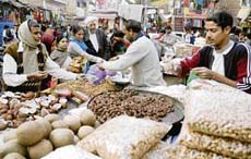 People buy dry fruits on the eve of Lohri in Jammu on Saturday. 