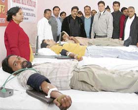 Activists of Bharatiya Janata Yuva Morcha (BJYM) donate blood on the birth anniversary of Swami Vivekanand in Ludhiana on Saturday.